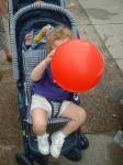 Savannah hides behind a red balloon_th.jpg 4.6K